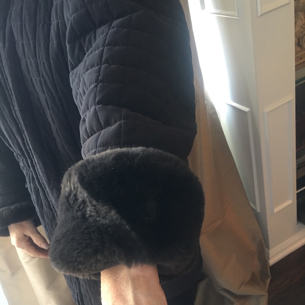 Black quilted jacket with fur cuffs and hood